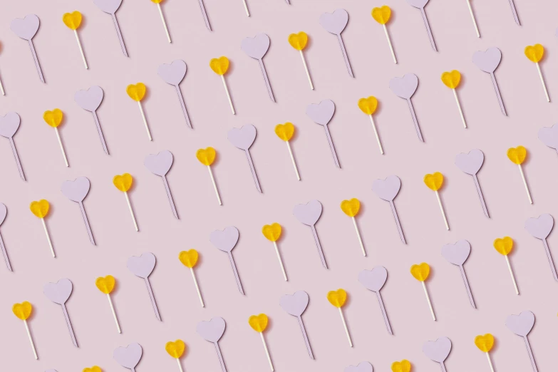 yellow and white heart shaped lollipops on a pink background, inspired by Peter Alexander Hay, violet color palette, background image, stick poke, cake