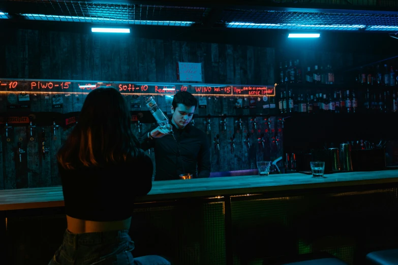 a woman standing in front of a bar talking on a cell phone, inspired by Elsa Bleda, pexels contest winner, holding a blue lightsaber, bottles of alcohol next to him, lachlan bailey, grindhouse