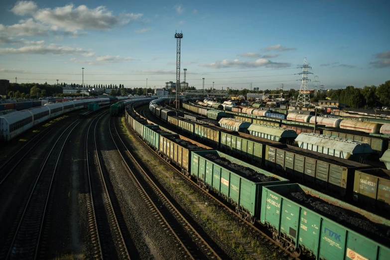 a train yard filled with lots of train cars, a portrait, by Sven Erixson, unsplash, rostov, a green, photographed for reuters, raphael personnaz