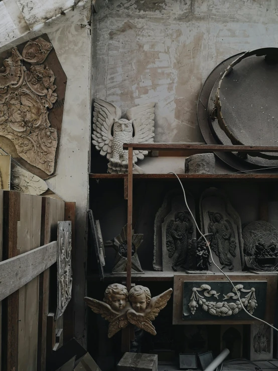 a room filled with lots of assorted items, a marble sculpture, by Jordan Grimmer, trending on unsplash, baroque, rustic and weathered, promo image, gothic aesthetic, inspect in inventory image