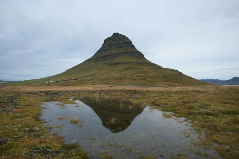 a large rock hill with a small dle