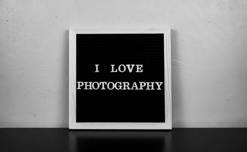 a black and white photograph with the words i love photography, a black and white photo, art photography, sign, display”, on a canva, fineartamerica