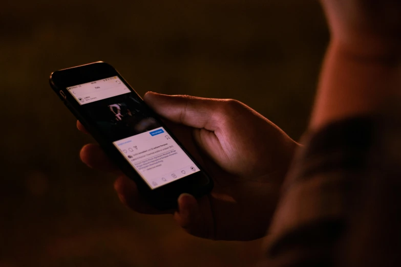 a close up of a person holding a cell phone, a picture, trending on unsplash, happening, people at night, ( ( theatrical ) ), facebook post, ignant