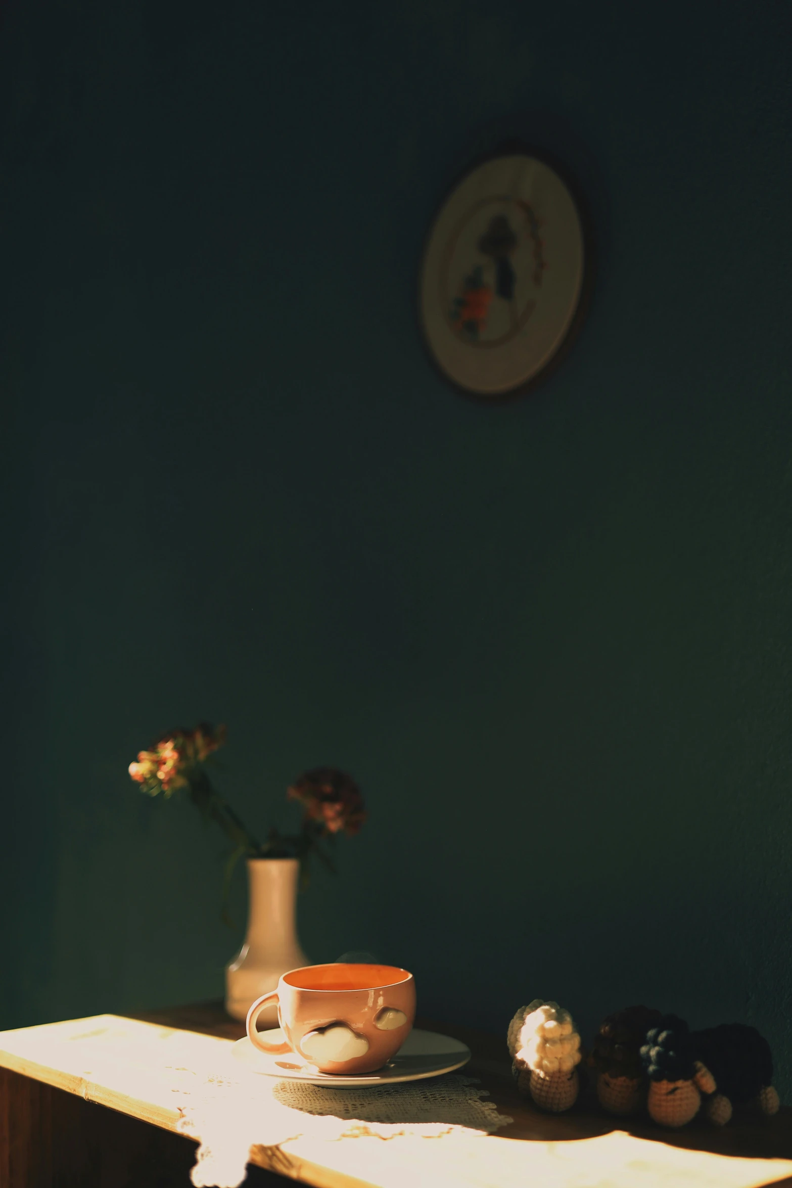 a wooden table topped with a vase filled with flowers, a still life, by Elsa Bleda, postminimalism, orange teal lighting, ( ( photograph ) ), porcelain, late evening