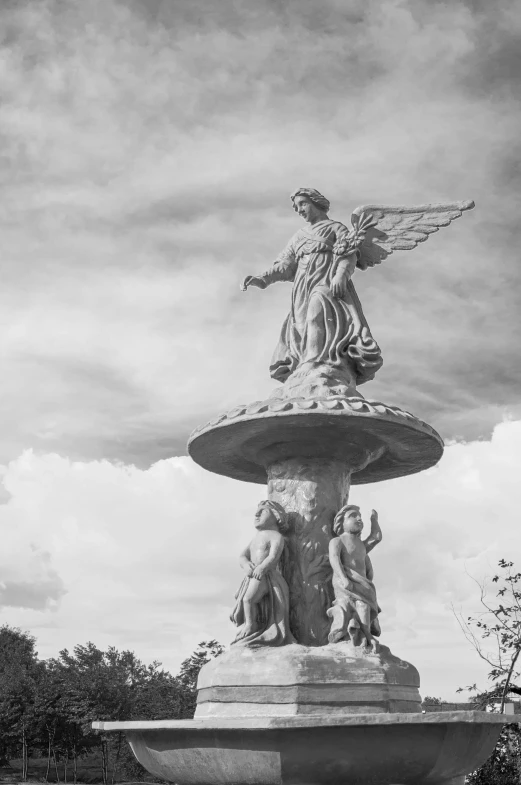 a black and white photo of a fountain, a statue, by Cherryl Fountain, clouds and wings and waves, old timey, angels, public art