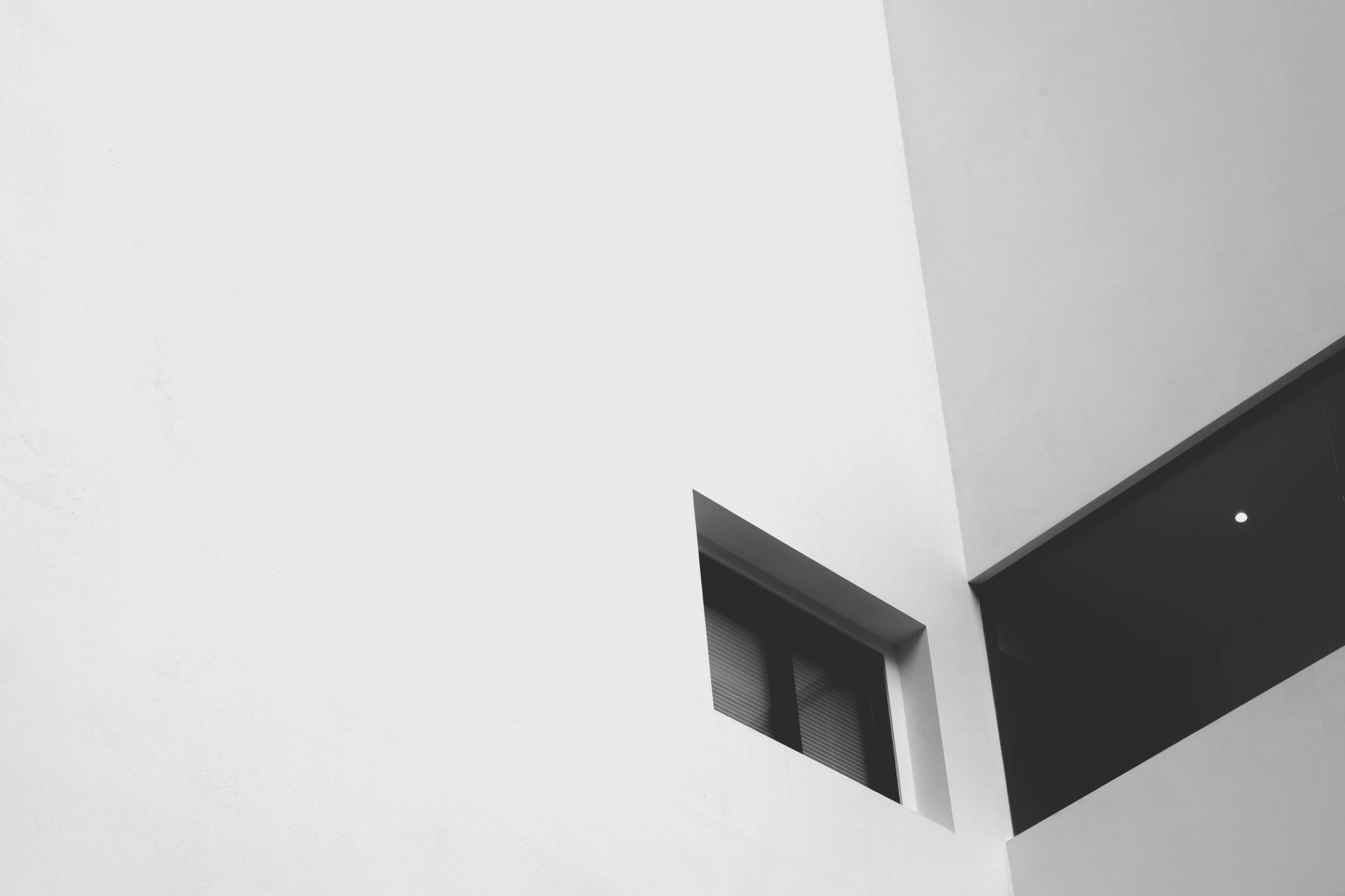 a black and white photo of a window in a building, unsplash, postminimalism, alvaro siza, square shapes, snapchat photo, white in color