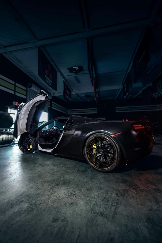 a black and white sports car with its door open