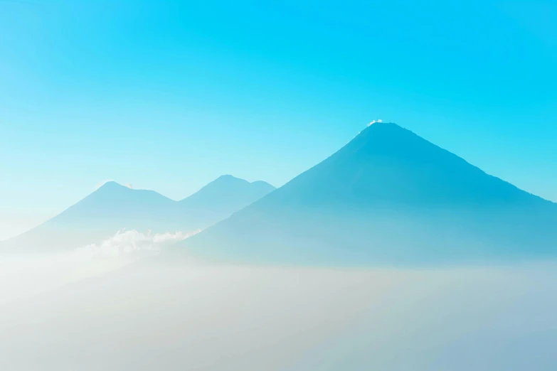 a long exposure s of a mountain in the fog