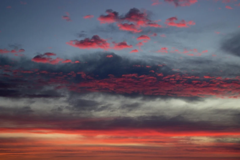 a large body of water under a cloudy sky, by Linda Sutton, pexels contest winner, romanticism, blood red colored sky, layered stratocumulus clouds, predawn, today\'s featured photograph 4k