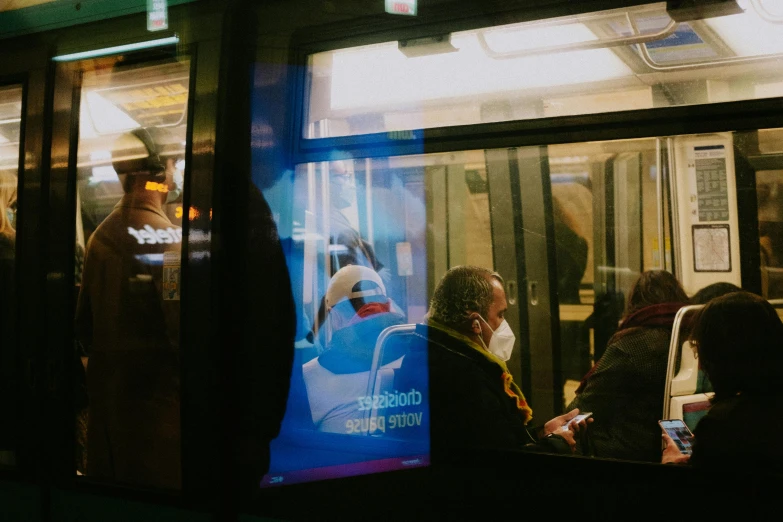 passengers on train with light coming through window