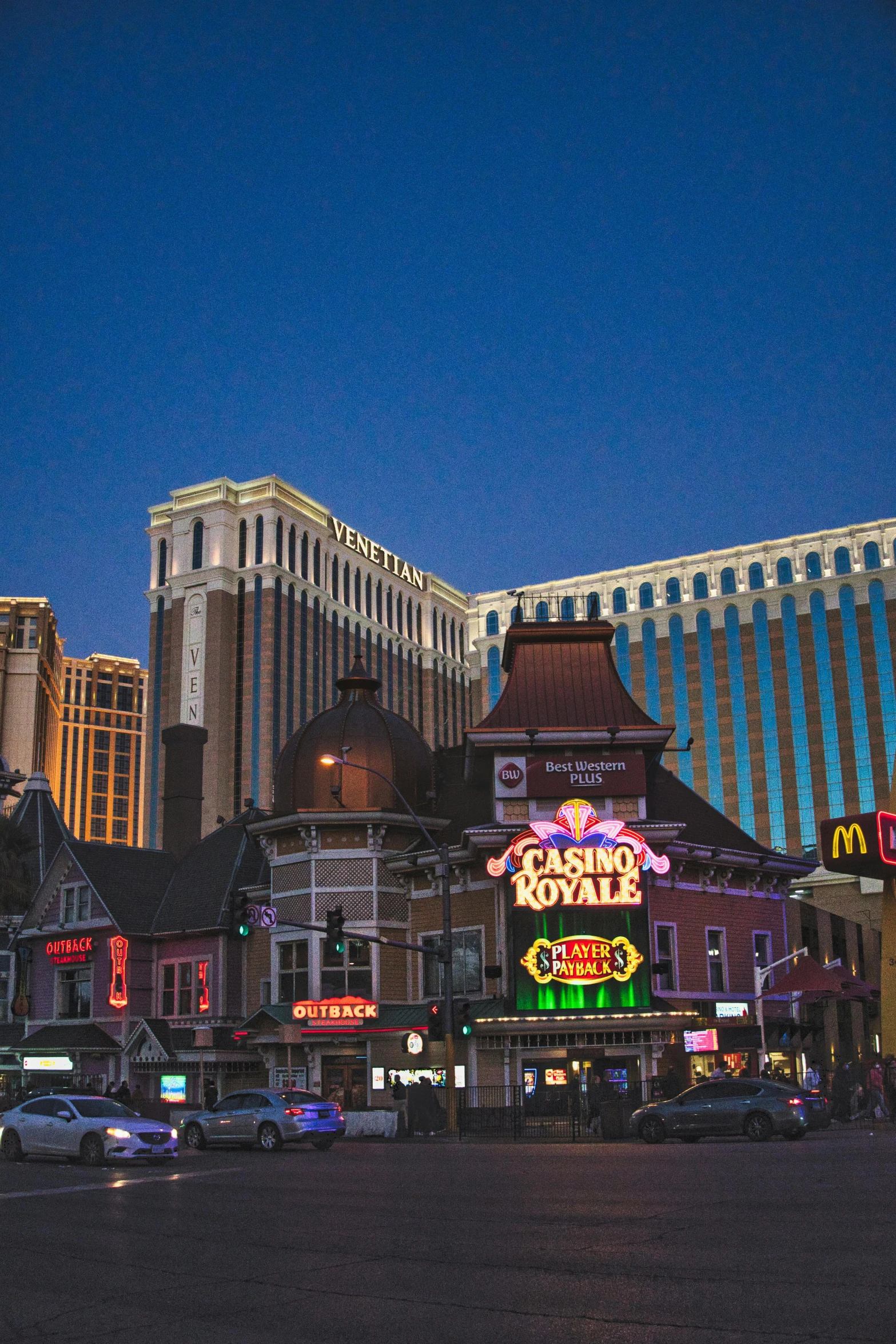 a group of buildings with lots of neon signs