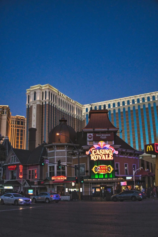 a group of buildings with lots of neon signs