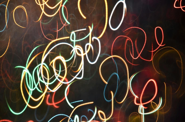 a blurry photo of a bunch of lights, pexels, generative art, scribbled lines, swirles, typographical experiments, instagram post