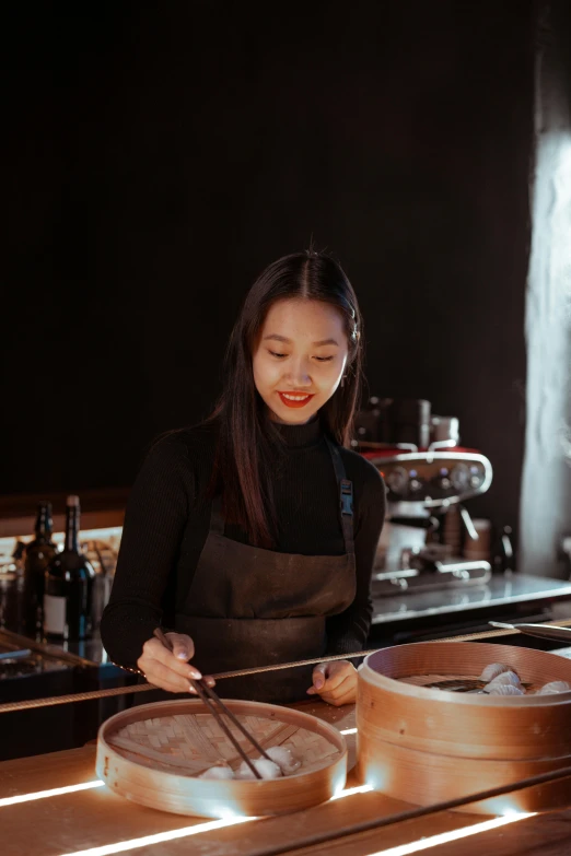 a woman that is standing in front of a counter, a portrait, inspired by Tan Ting-pho, pexels contest winner, chef table, black, smooth texture, gif