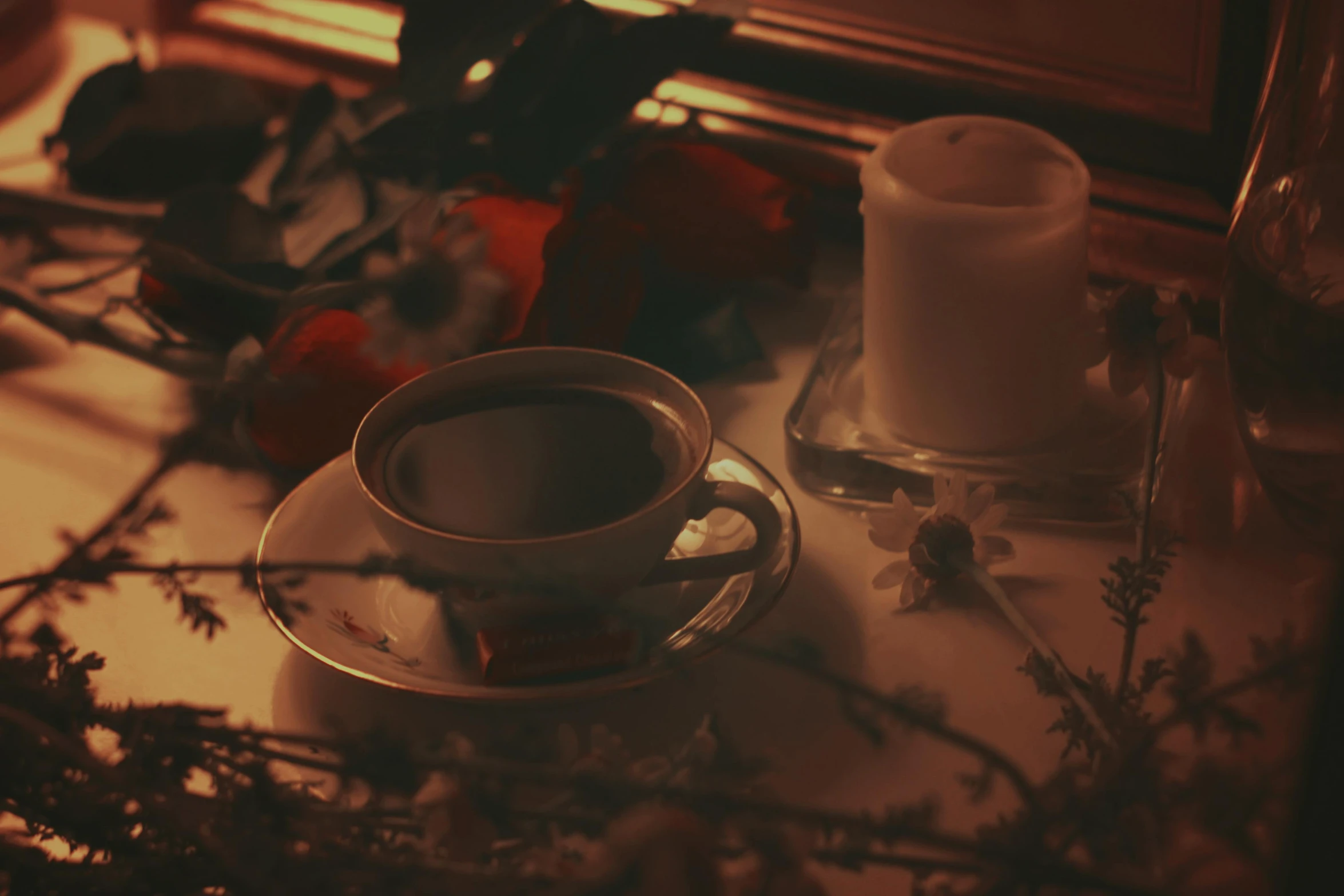 a cup of coffee sitting on top of a table, inspired by Elsa Bleda, romanticism, gothic horror vibes, profile image, candlelight, lo-fi