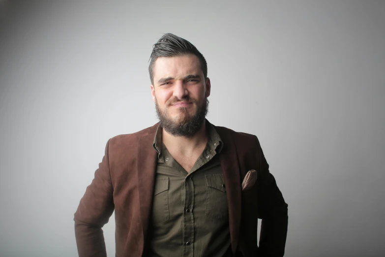 a man standing with his hands in his pockets, an album cover, by Mathias Kollros, pexels contest winner, headshot profile picture, bearded, corporate photo, brown