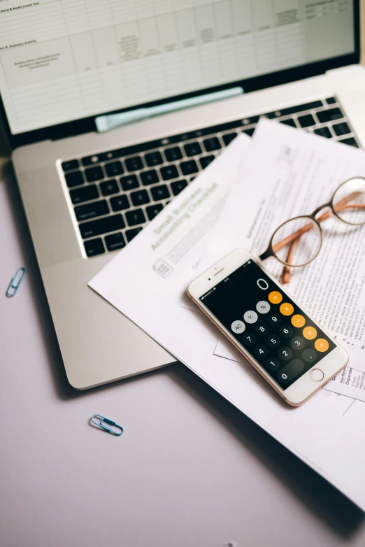 a laptop computer sitting on top of a desk next to a calculator, trending on pexels, thumbnail, ƒ5.6, instagram story, - 9