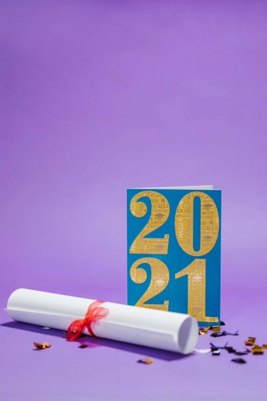 a graduation diploma laying on top of a pile of confetti, by Julia Pishtar, academic art, greeting card, purple tubes, 2022 photograph, 24k