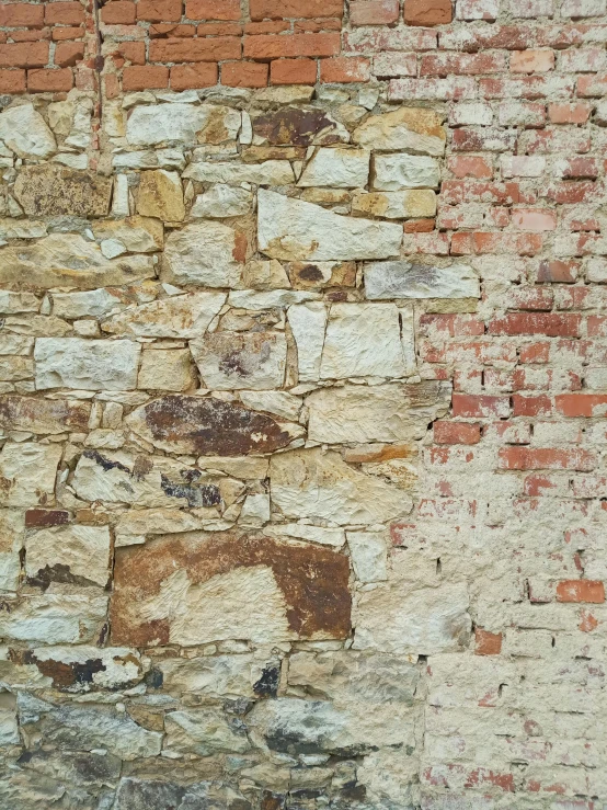 a brick wall with s and peeling paint