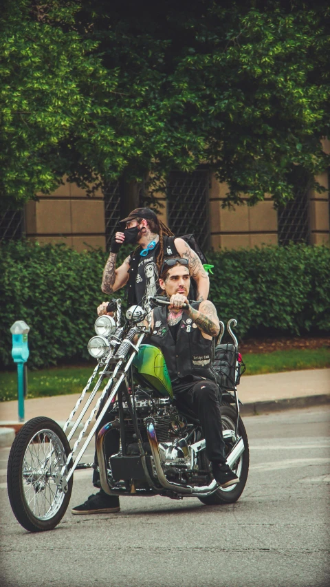 a group of people riding on the back of a motorcycle, by Andrew Stevovich, pexels contest winner, photorealism, lil peep, rockabilly hair, a green, from wheaton illinois