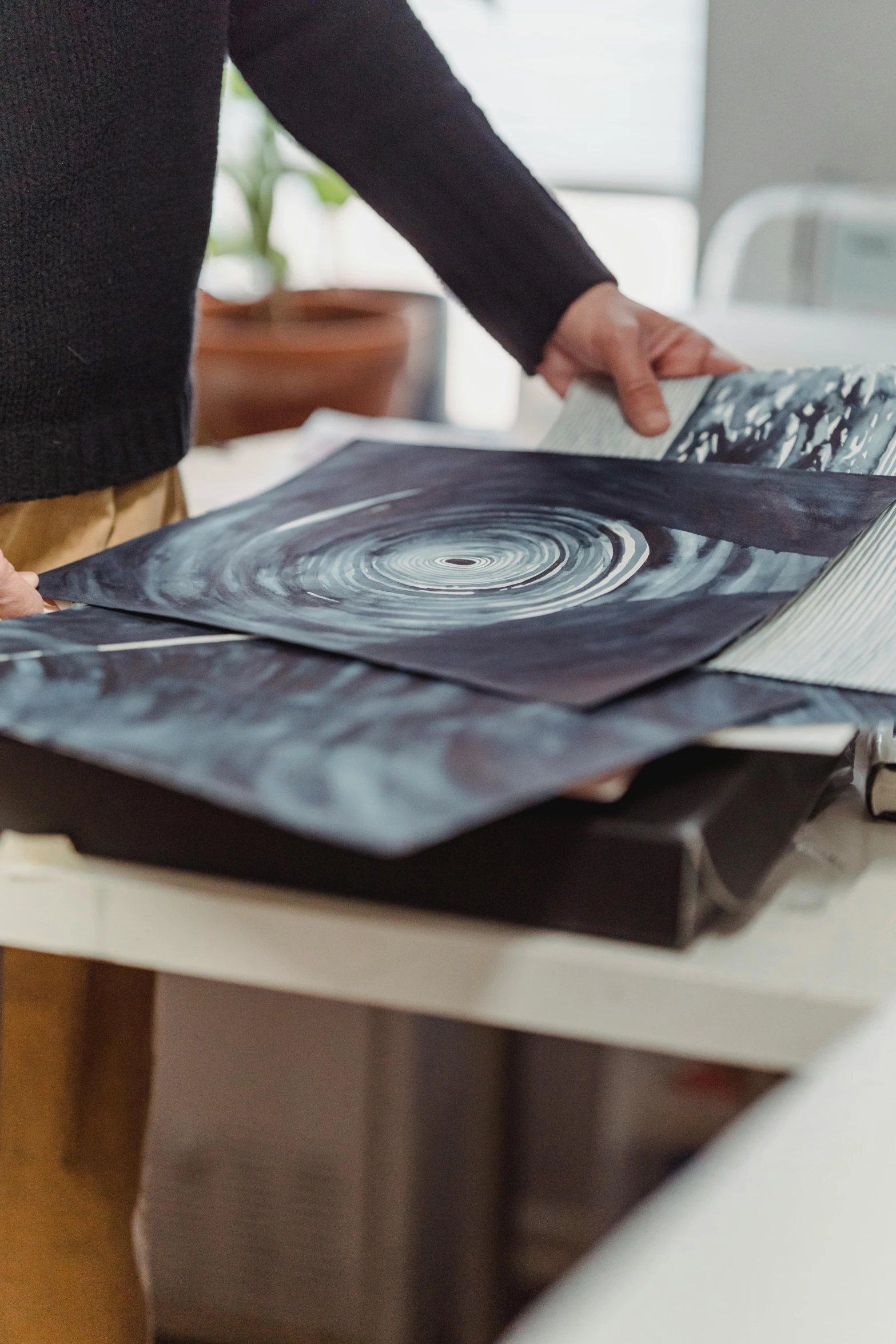 a man that is standing in front of a desk, an album cover, trending on unsplash, process art, spinning records, xray art, high detailed print, medium close up shot