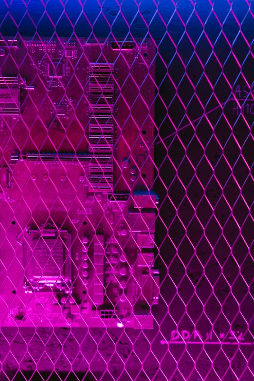 a view of a building through a chain link fence, an album cover, inspired by Richard Anuszkiewicz, holography, bright pink purple lights, motherboard circuitry, texture detail, photograph taken in 2 0 2 0