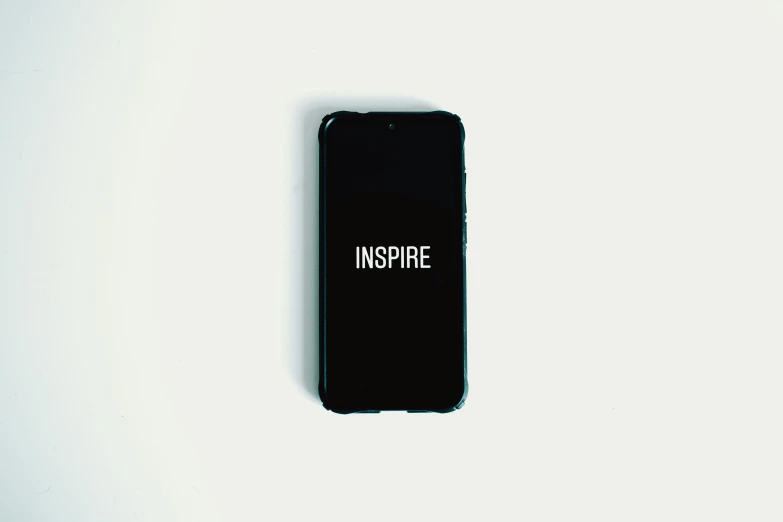 a black phone sitting on top of a white table, inspired by Johann Christian Brand, trending on unsplash, inspirational quote, inspire, ffffound, corporate phone app icon
