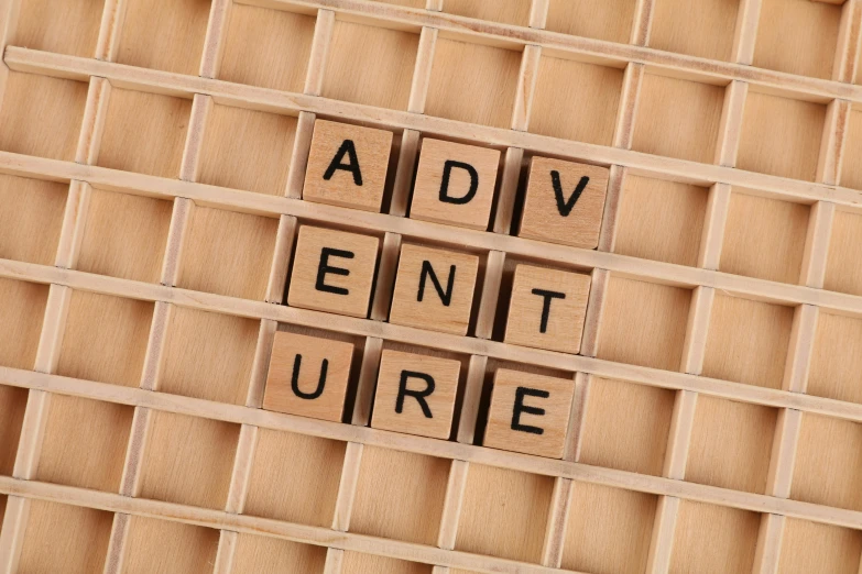 a pile of wooden letters sitting on top of a table, by Edward Clark, trending on pixabay, expectation of adventure, square, grid of styles, wearing adventure gear