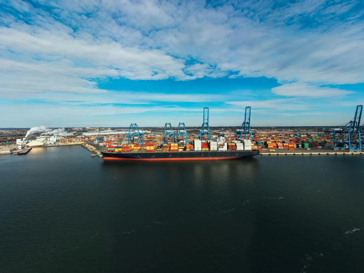 a large cargo ship sitting on top of a body of water, port, 1 petapixel image, ultrawide image, high quality upload