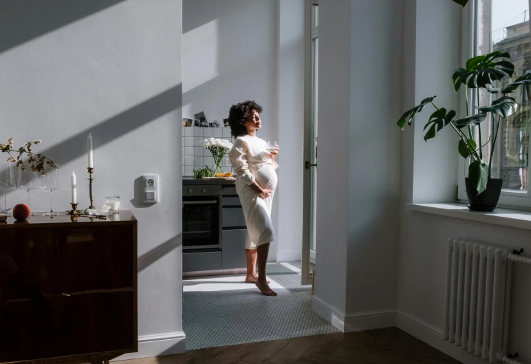 a person standing in the doorway of a room