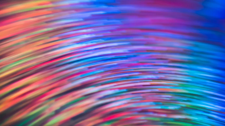 a blurry photo of a rainbow colored background, unsplash, holography, colorful wires, rippling reflections, macro bokeh ”, vinyl material