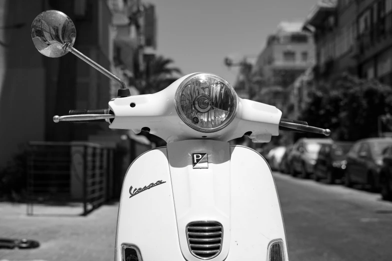 a black and white photo of a motor scooter, on a bright day, naples, very round headlights, uploaded