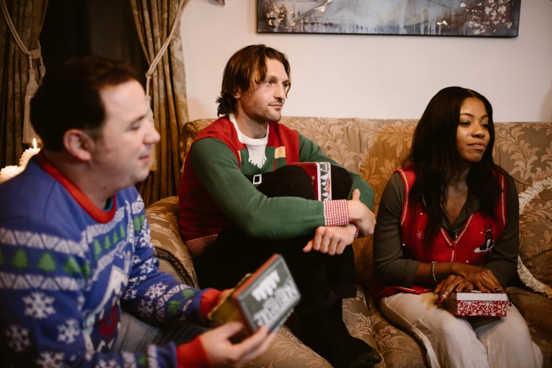 a group of people sitting on top of a couch, christmas, profile image, promotional image, wearing festive clothing