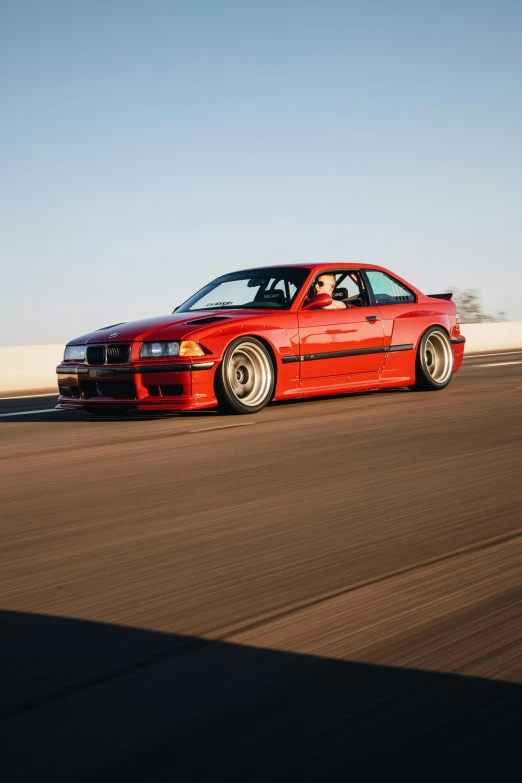 a very cool looking modified orange car in the middle of the desert