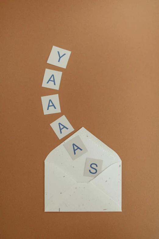 a close up of a piece of paper with letters on it, by Yosa Buson, unsplash contest winner, mail art, yawning, khakis, birthday card, seeds