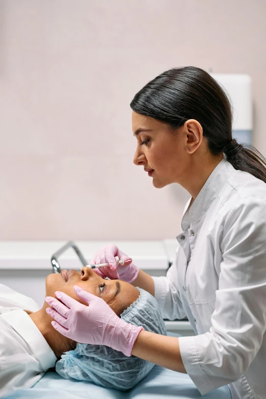 a woman getting her teeth examined by a doctor, a photo, by Matija Jama, renaissance, dark circles under bemused eyes, square jaw-line, synthetic bio skin, surgical supplies