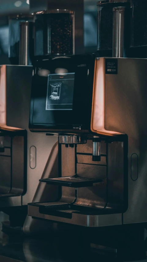 a row of coffee machines in a coffee shop, a computer rendering, by Matt Cavotta, unsplash contest winner, reflections in copper, in a darkly lit laboratory room, vsco film grain, 15081959 21121991 01012000 4k