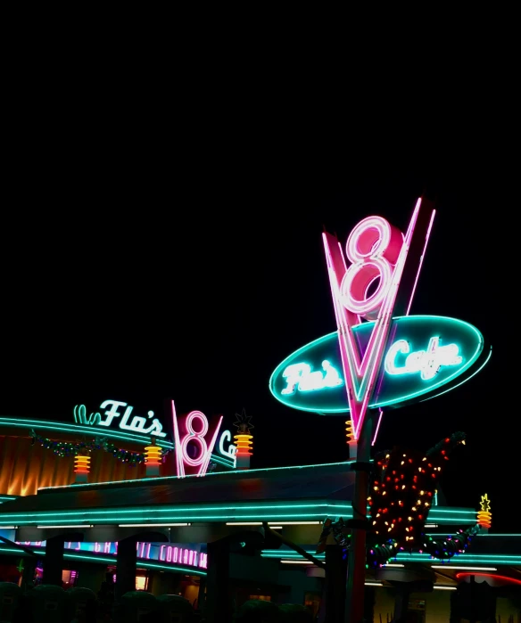 a large neon sign on the side of a building, disney 8 k photo, diner scene, unsplash contest winning photo, eight eight eight