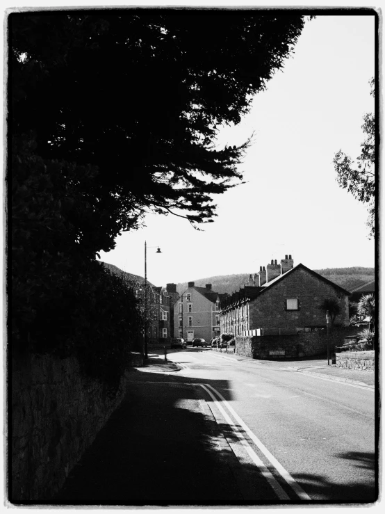 a black and white po of houses on the road