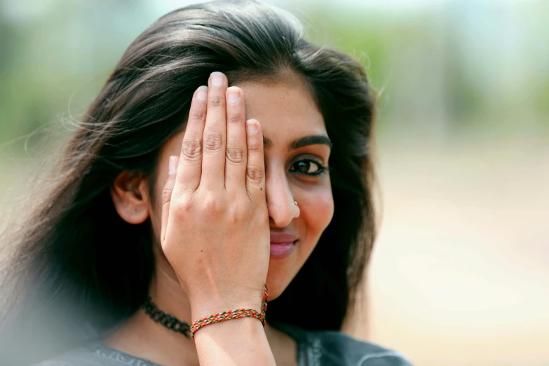 a woman covering her face with her hands, by Max Dauthendey, actress, jayison devadas, smirking, hand gesture