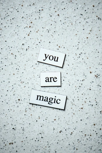 a piece of paper with the words you are magic written on it, unsplash, magical realism, magnetic, magic spell icon, concrete poetry, three