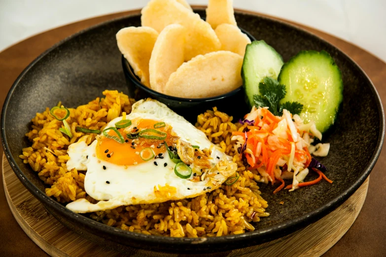 a black plate topped with rice and a fried egg, bali, square, medium, thumbnail