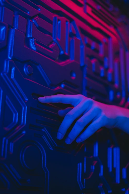 a close up of a person touching a circuit board, a hologram, by Adam Marczyński, unsplash, interactive art, pink and blue neon, normal map, the walls purple and pulsing, red and blue black light