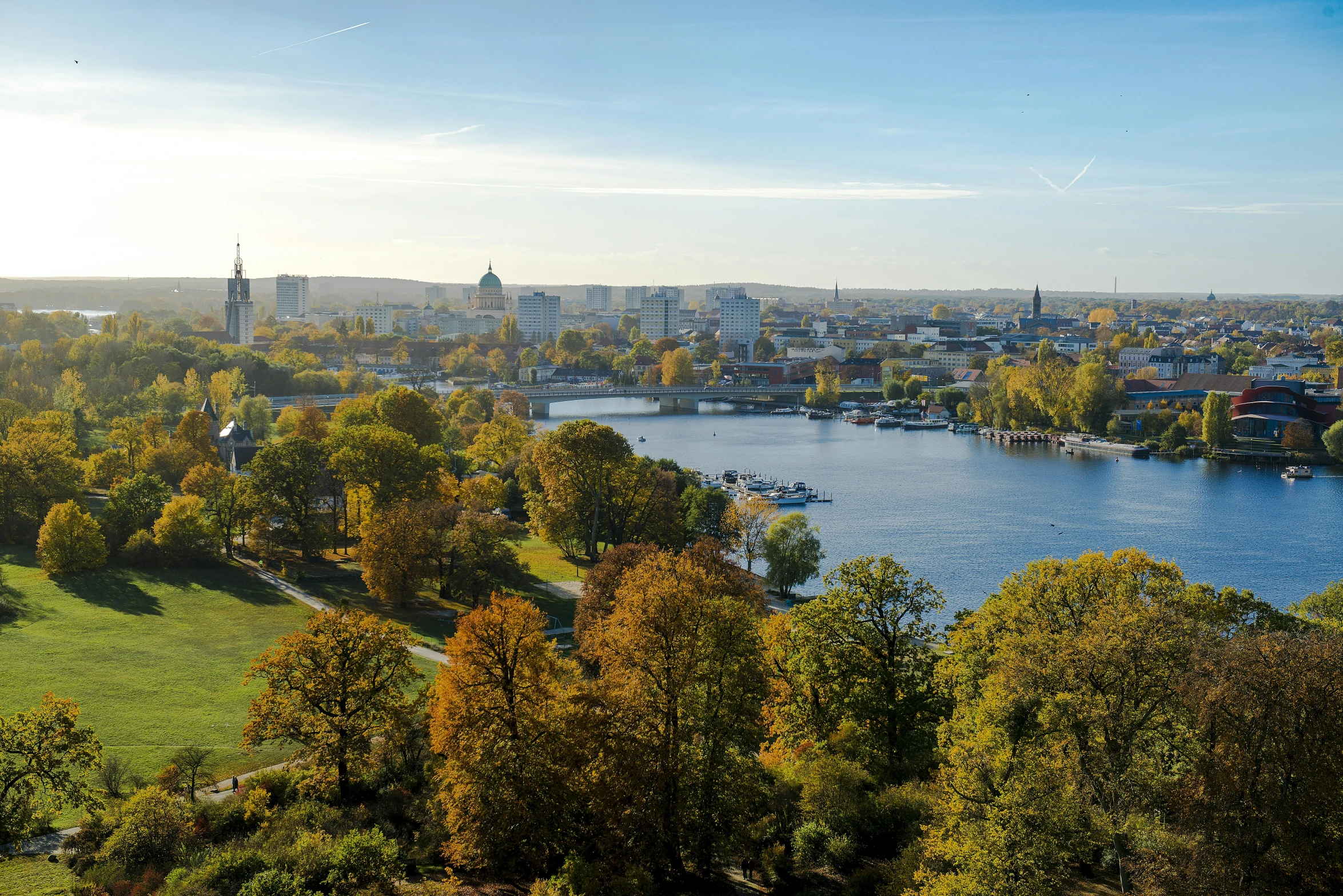 a large body of water surrounded by trees, visual art, stockholm city, parks and monuments, expansive view, slide show