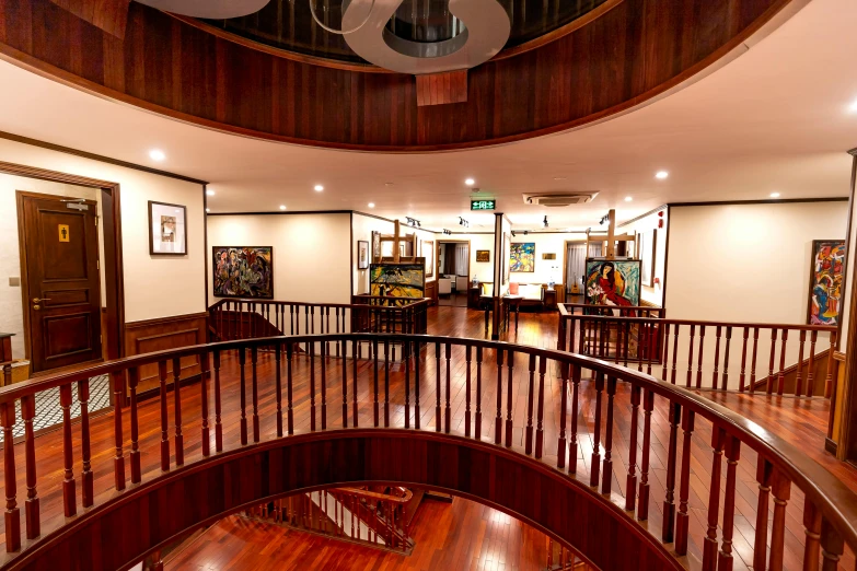 the interior of a large building with wood floors