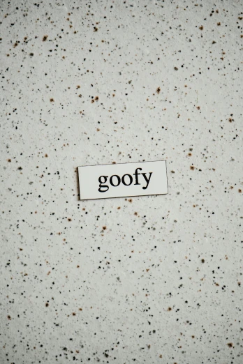 a piece of paper with the word goofy on it, an album cover, trending on pexels, lofi aesthetic, starry, words, gray concrete
