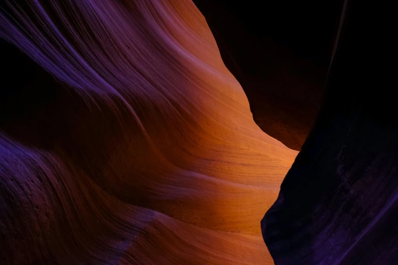 a very close up picture of the sunlight reflecting on a narrow mountain