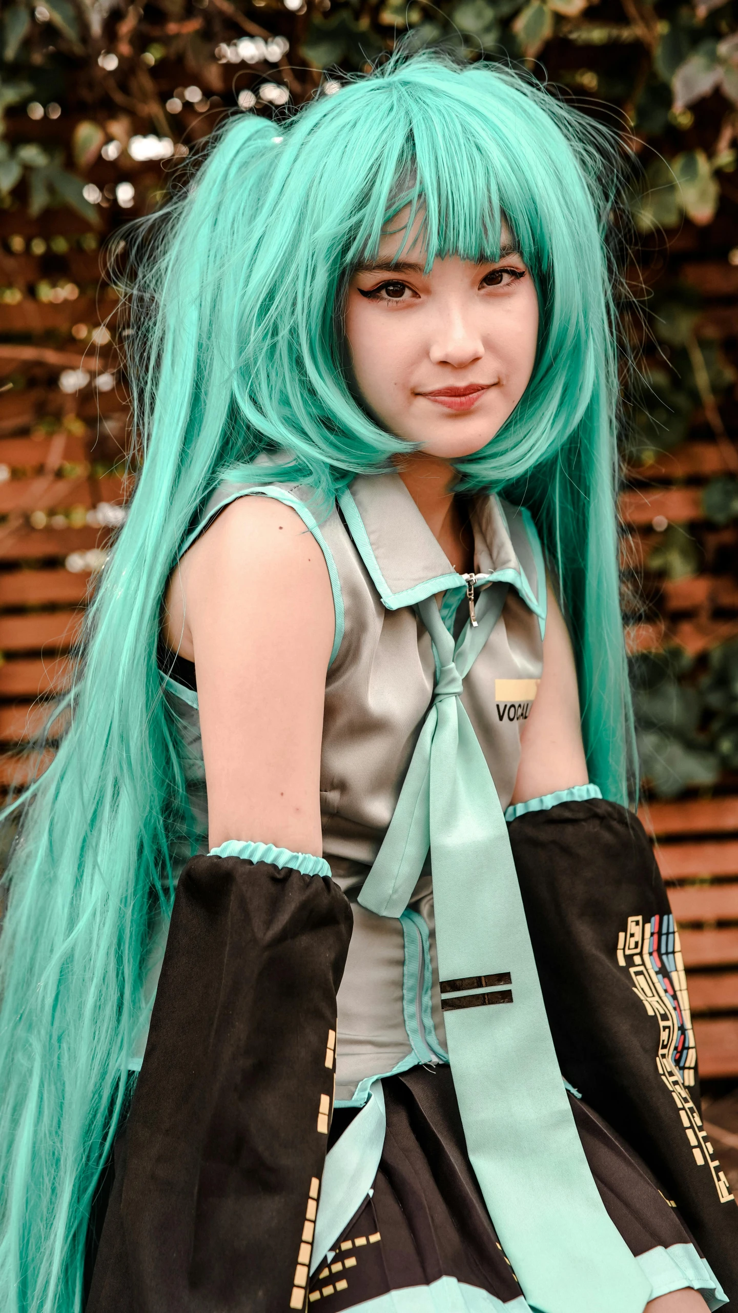 a young woman with green hair and a handbag