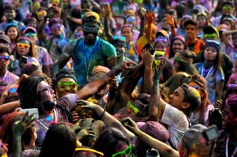 a large group of people covered in colored paint, fan favorite, flourescent colors, thumbnail, lots of sunlight