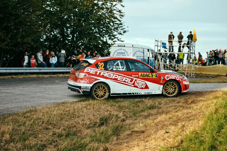 an unusual rally car drives on a race course